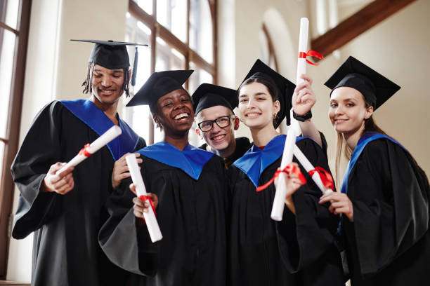 istock Diverse Group of Students Graduating College 1396696448