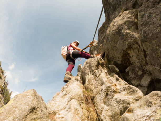 istock Woman rock climbing on Via Ferrata route 1396696868
