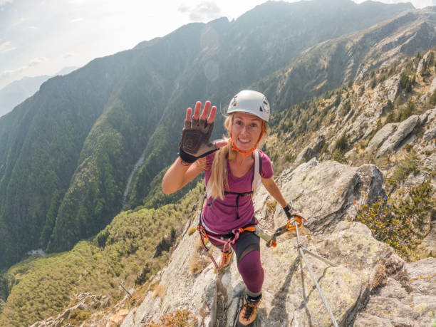 istock POV from climbers hands celebrating on top of climb 1396696914