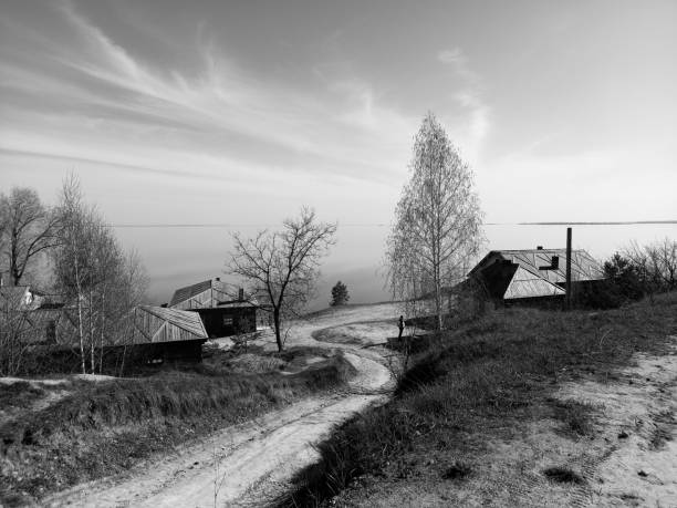 Country road against river in sunny day