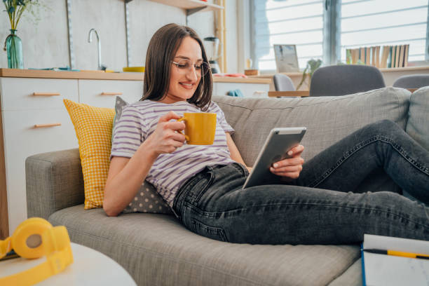 istock Young woman relaxing on the sofa 1396697137