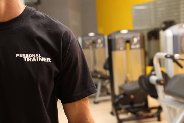istock Personal trainer in modern gym, closeup view 1396697826