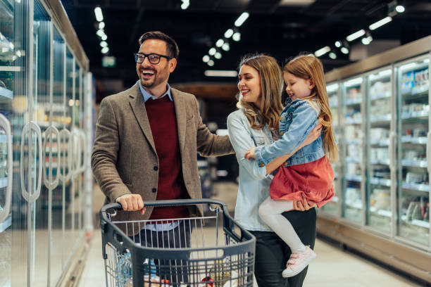 istock Smiling family shopping together 1396698424