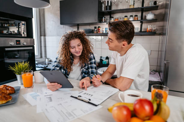 istock Young Couple Discussing Their Finances 1396698483
