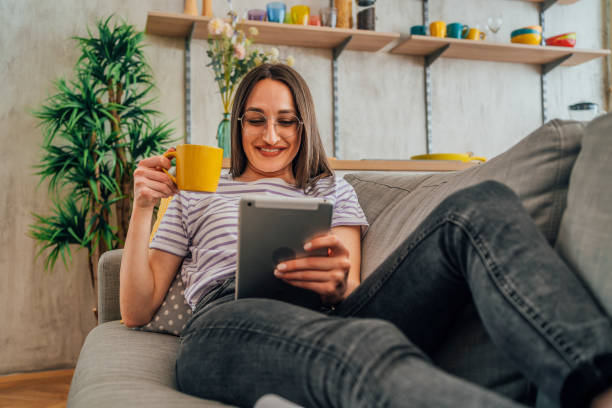 istock Young woman relaxing on the sofa 1396698656