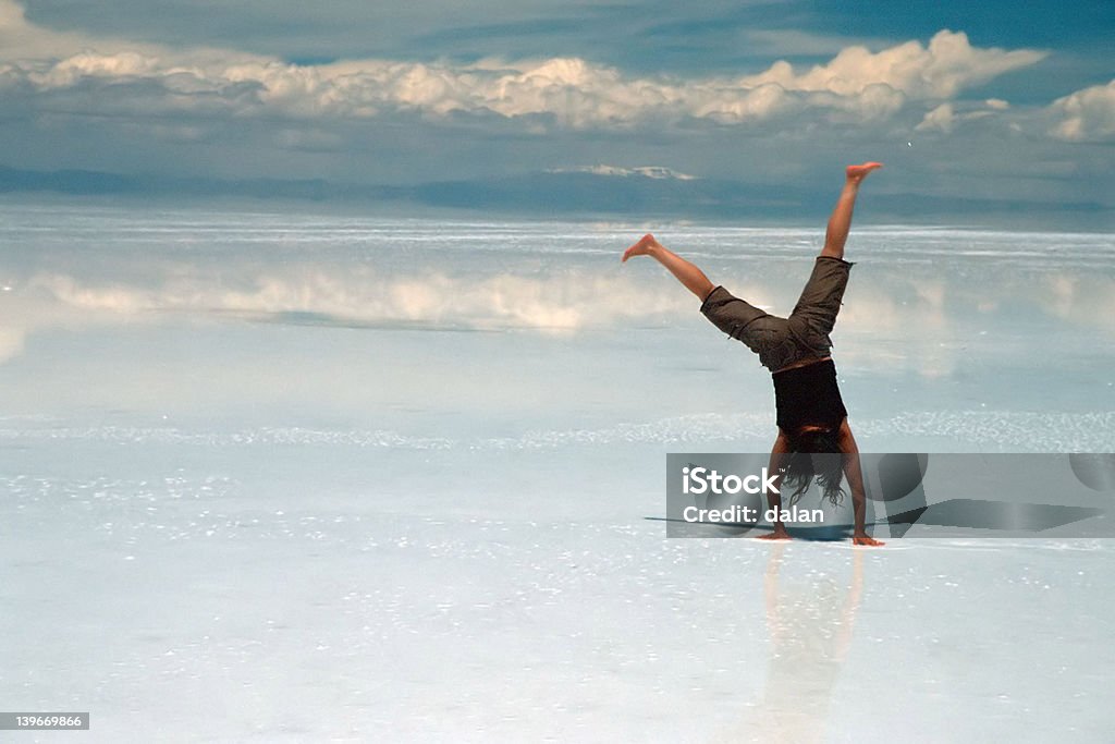 Woman doing acrobatics on ice Acrobat Stock Photo