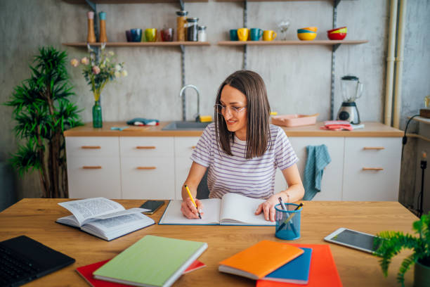 istock Motivated female student preparing for test or exam 1396698702