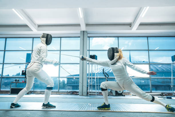 istock Female fencing competitive duel 1396700760