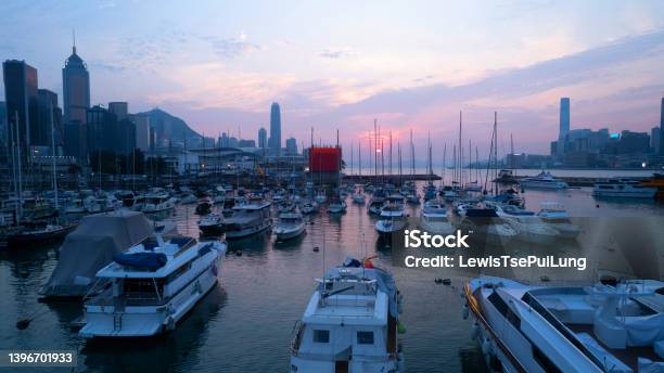 Victoria Harbour And Yachts Parking In Typhoon Shelter During Sunset Stock Photo - Download Image Now
