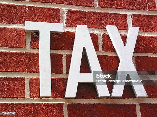 Tax Sign Stock Photo - Download Image Now - Brick, Brick Wall, Concrete