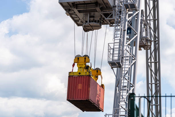 istock A container gantry crane on a rail loads the container into a barge standing on the banks of the river Rhine in Germany. 1396702642