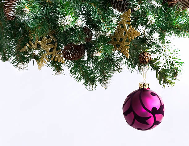 magenta christmas ornaments on tree