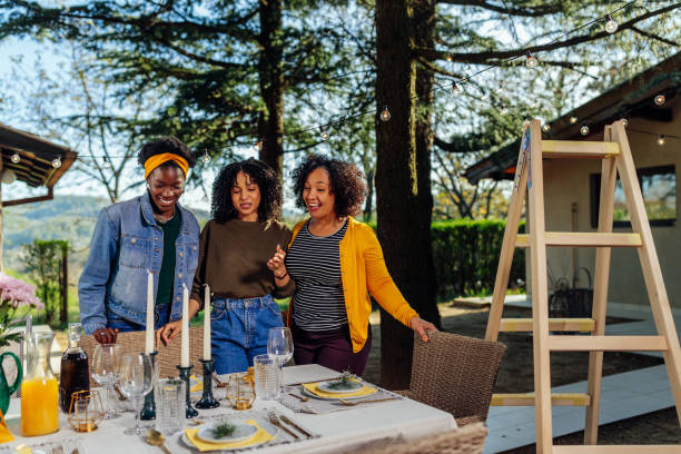 istock Family members talking about table decoration 1396710331