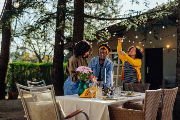 istock Three women preparing for garden party 1396710371