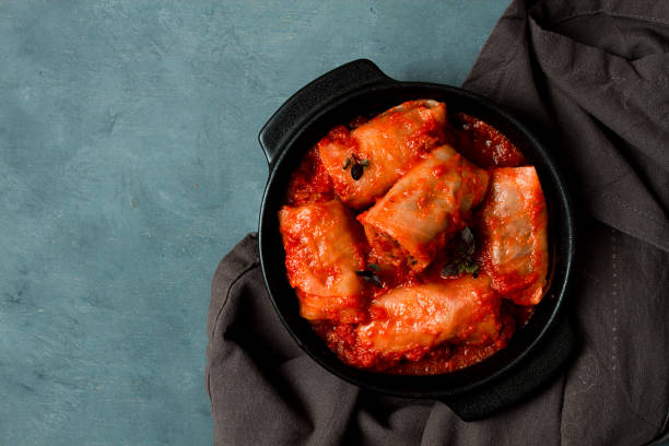 istock Stuffed cabbage rolls in tomato sauce, stuffed cabbage leaves, minced meat with rice, on a dark background, top view, no people, 1396713488