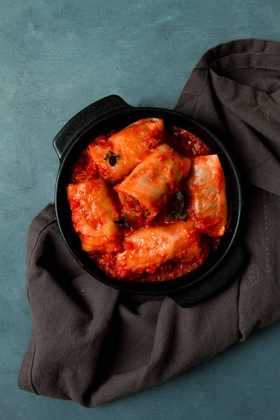 istock Stuffed cabbage rolls in tomato sauce, stuffed cabbage leaves, minced meat with rice, on a dark background, top view, no people, 1396713492