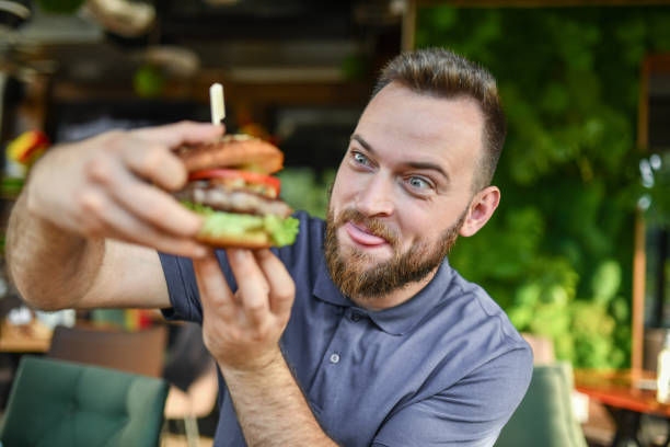 istock Excited Male Preparing To Eat Delicious Burger 1396715513