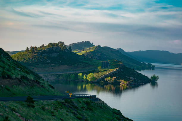 Sunrise on Horsetooth reservoir winding road
