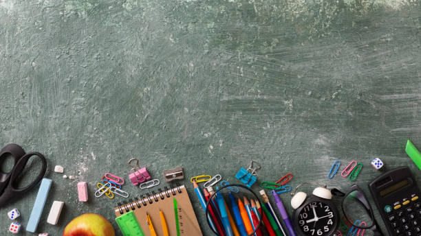 istock School background with school supplies and copy space 1396716960