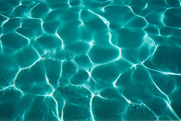 Pool water Picture of a sparkling water in a swimming pool plushka stock pictures, royalty-free photos & images