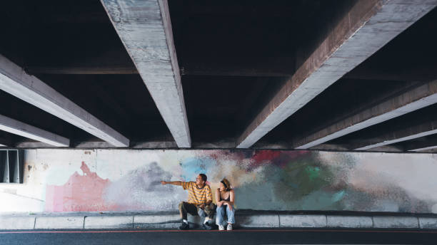 istock In Asia, two young Taiwanese millennials chat in an underpass. 1396718576