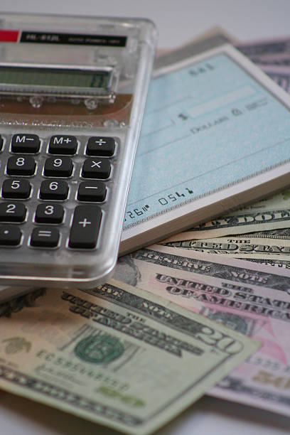 calculator and  money, checkbook stock photo
