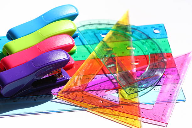 multicolored staplers  and rulers stock photo