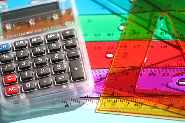 calculator and multicolored rulers stock photo