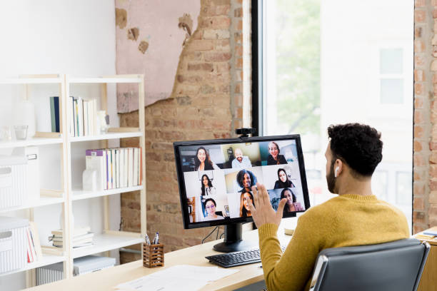 istock Sitting in office, unrecognizable male manager leads virtual meeting 1396721873