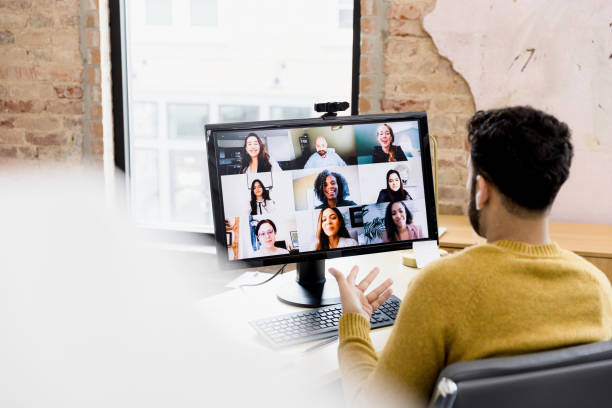 istock Man leads teleconference meeting with co-workers 1396721879