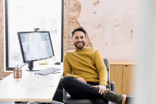 istock Confident male business owner smiles for camera 1396721883