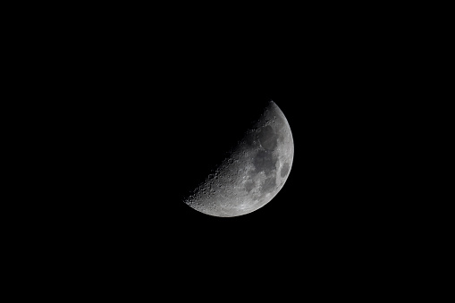 waxing moon in detail over the darkness of night