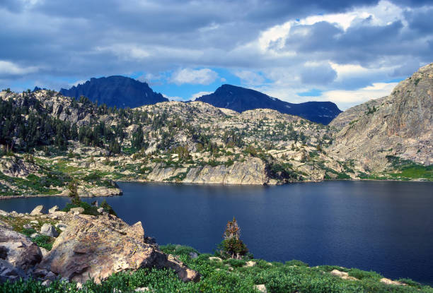 istock Sunny Day on a Mountain Lake 1396722782