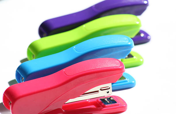 multicolored  staplers stock photo