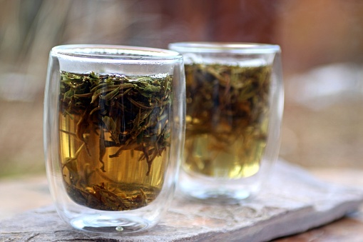 White tea brewing in the transparent glasses