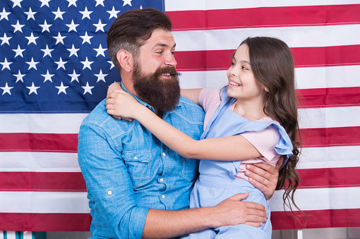 Father american bearded hipster and cute little daughter with USA flag. Independence is happiness. Independence day holiday. Freedom fundamental right. How do americans celebrate independence day.