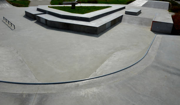 istock Skateboard park with concrete cement surface with concrete skateboard obstacles is designed for roller sports. Cycling is not allowed except for freestyle bikes. icing winter morning sunrise 1396725067