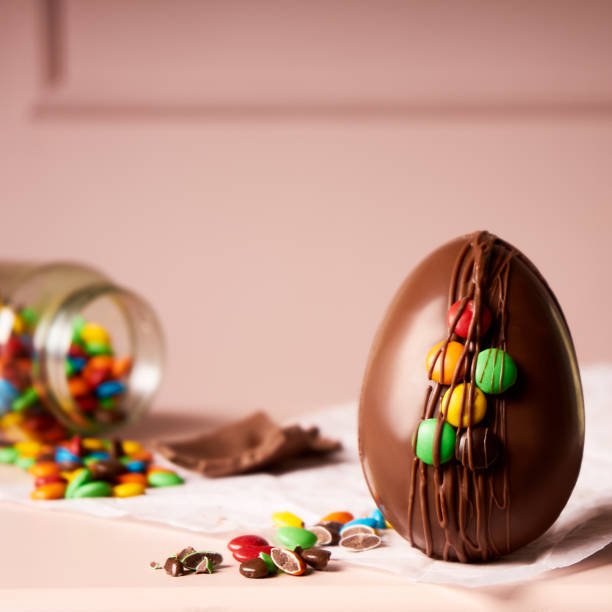 istock easter egg and sprinkles spilled from a jar on pink background 1396726464