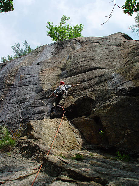 istock rock climber leading the route 139672659
