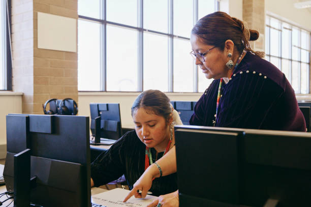istock High School Teacher and Students in a School Classroom 1396729742