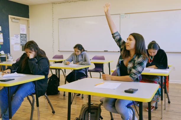 istock High School Teacher and Students in a School Classroom 1396730743