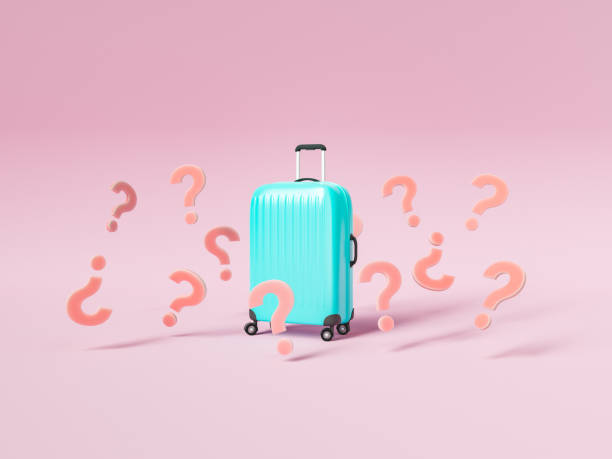 Suitcase surrounded with question marks stock photo