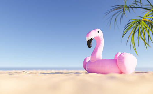 3D illustration of pink flamingo float placed on sandy beach against cloudless blue sky during summer vacation