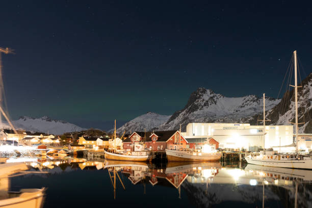 Svolvaer by dusk in Vagan Nordland Lofoten archipelago  North of Norway . Svolvaer by dusk in Austvagoya island Vagan Nordland Lofoten archipelago  North of Norway on March 12, 2022. View from the island of Lamholmen, in the middle of Svolvær Harbour. harbor of svolvaer in winter lofoten islands norway stock pictures, royalty-free photos & images