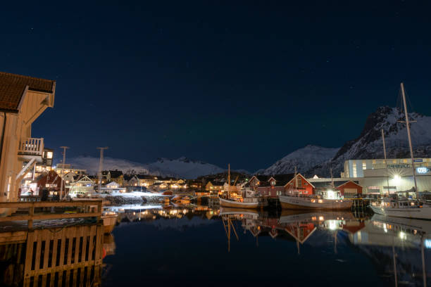 Svolvaer by dusk in Vagan Nordland Lofoten archipelago  North of Norway . Svolvaer by dusk in Austvagoya island Vagan Nordland Lofoten archipelago  North of Norway on March 12, 2022. View from the island of Lamholmen, in the middle of Svolvær Harbour. harbor of svolvaer in winter lofoten islands norway stock pictures, royalty-free photos & images