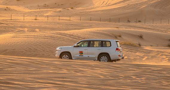 11 November 2021, UAE, Dubai: Desert Safari along the sand dunes in Dubai or Abu Dhabi, UAE - traditional entertainment for tourists