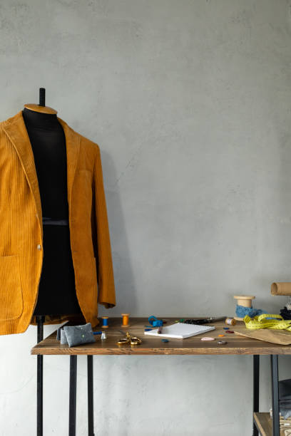 istock Sewing tools and tailor suit jacket at tailor mannequin. Concept of clothes atelier 1396732000