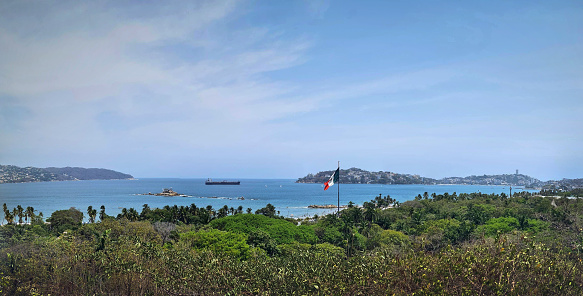 panoramic image of the main bay of Acapulco on a sunny day, seen from a hill