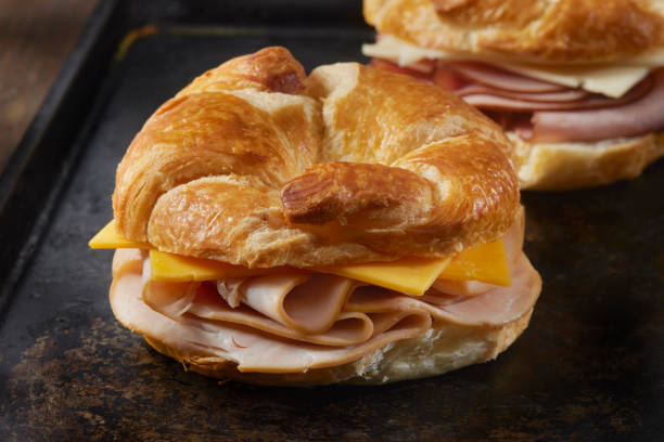 istock Roast Turkey and Cheddar Cheese Croissant Sandwich 1396733339