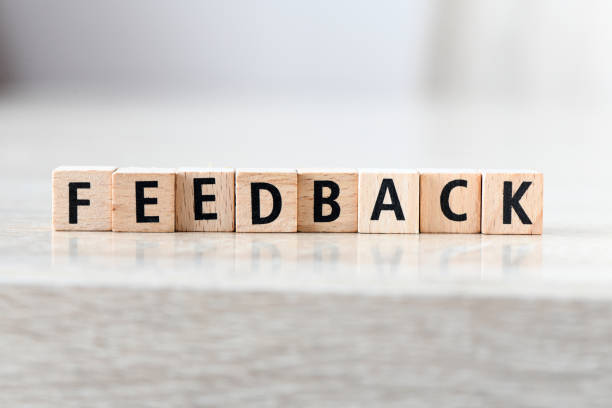 istock Word FEEDBACK arranged from wooden letters on light background. 1396734776